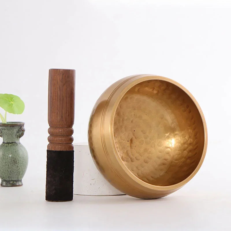 Authentic handmade Tibetan brass singing bowl from Nepal, including leather mallet.