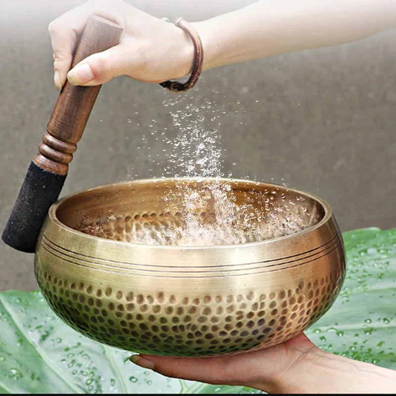 Authentic handmade Tibetan brass singing bowl from Nepal, including leather mallet.