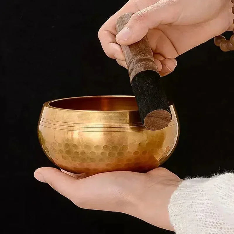Authentic handmade Tibetan brass singing bowl from Nepal, including leather mallet.